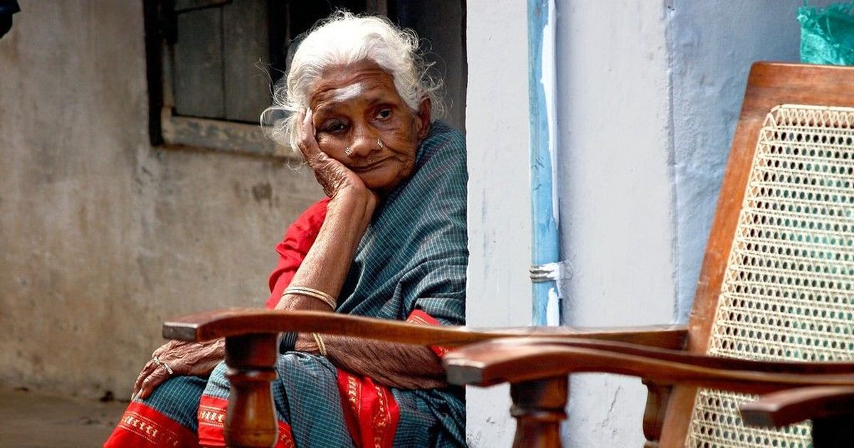 Volunteer providing compassionate care, warmth, and conversation to a senior citizen